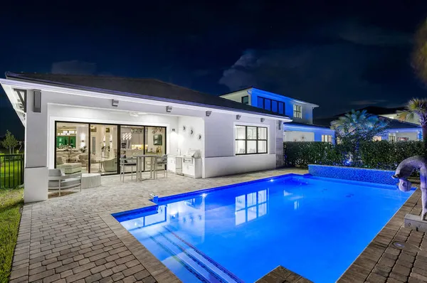 a view of swimming pool with seating space