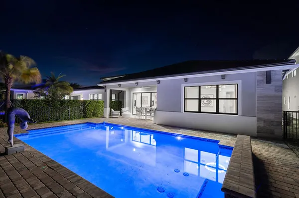 a view of swimming pool with seating space