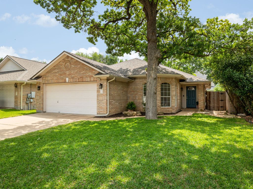 2316 Clover Ridge Drive Cedar Park, TX 78613 - Photo 1 of 1 a front view of a house with a garden