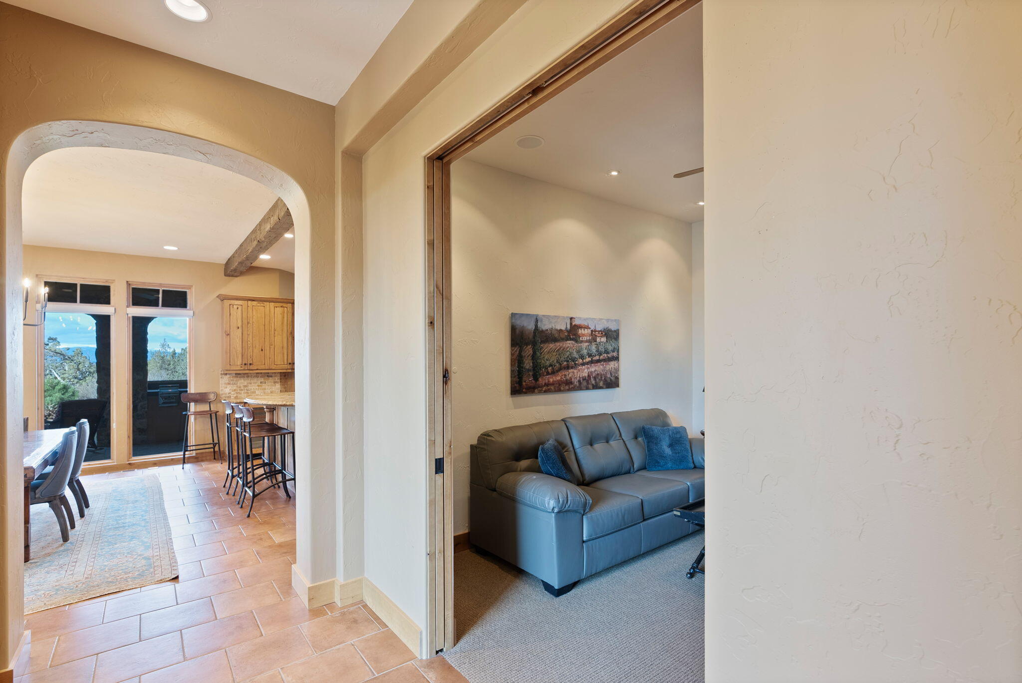 22887 Ghost Tree Lane Bend, OR 97701 - Photo 36 of 97 Arched doorways in the breezeway with multiple french doors connecting the foyer to the kitchen and office/4th bedroom (lacks a closet)