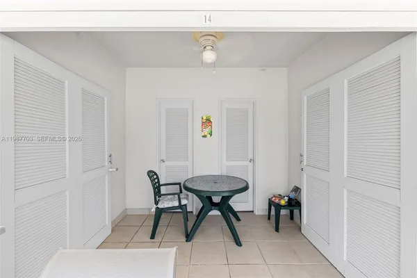 a room with a table and chairs