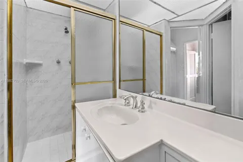 a bathroom with a sink and shower