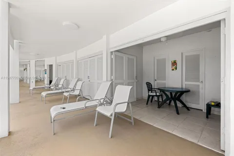 a view of a livingroom with furniture and a table