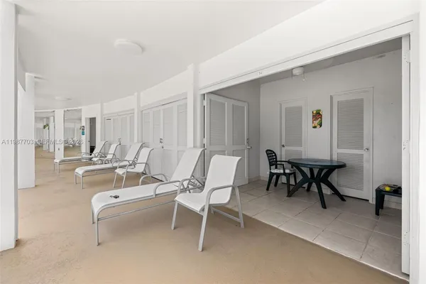 a view of a livingroom with furniture and a table