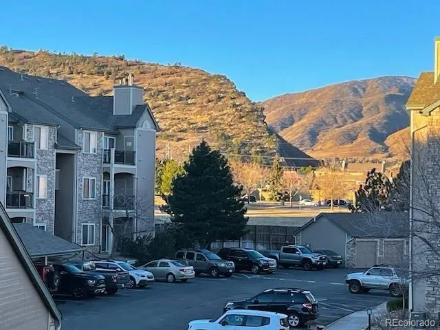 a view of a street with a building in the background