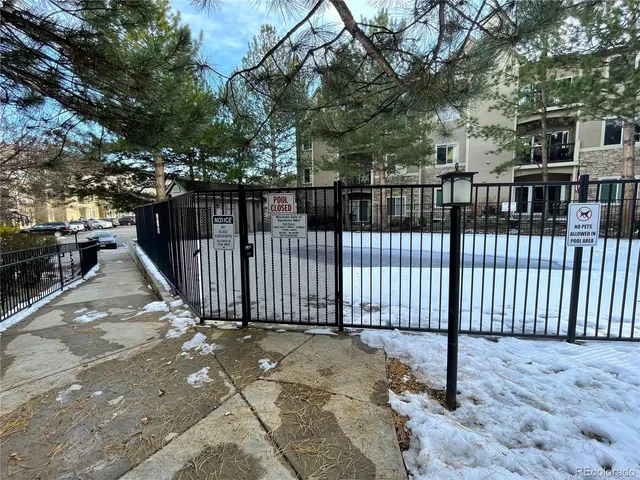 a view of a backyard with a fence