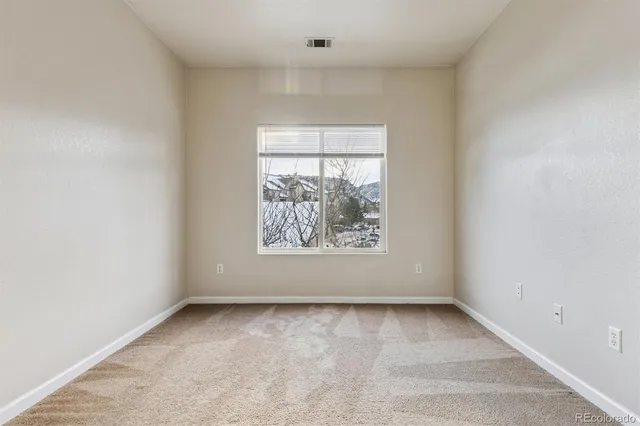 a sign that is sitting in front of flowers