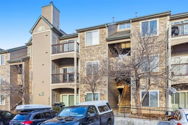 a front view of a residential apartment building with a street