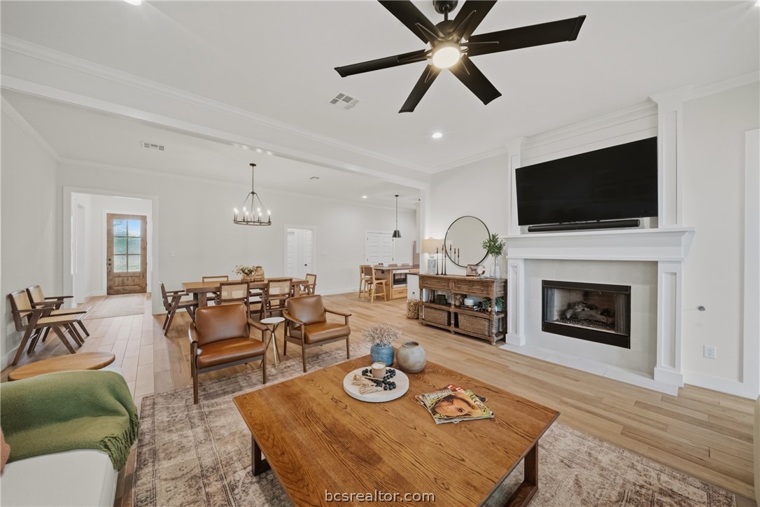 3520 Fairhope Way Bryan, TX 77808 - Photo 14 of 39 a living room with furniture a flat screen tv and a fireplace