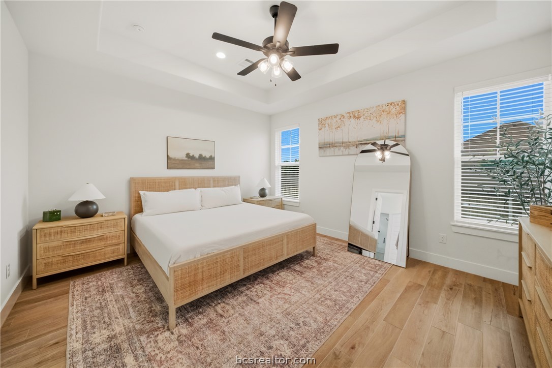 3520 Fairhope Way Bryan, TX 77808 - Photo 15 of 39 a spacious bedroom with a bed and a chandelier