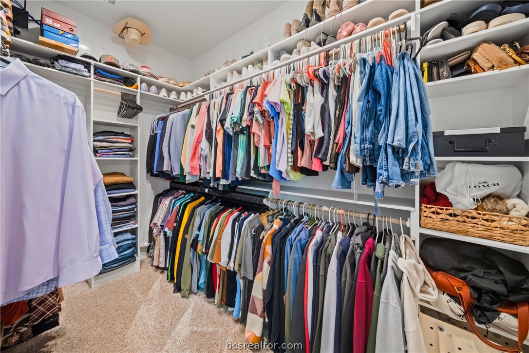 3520 Fairhope Way Bryan, TX 77808 - Photo 20 of 39 a view of walk in closet with clothes and shoes
