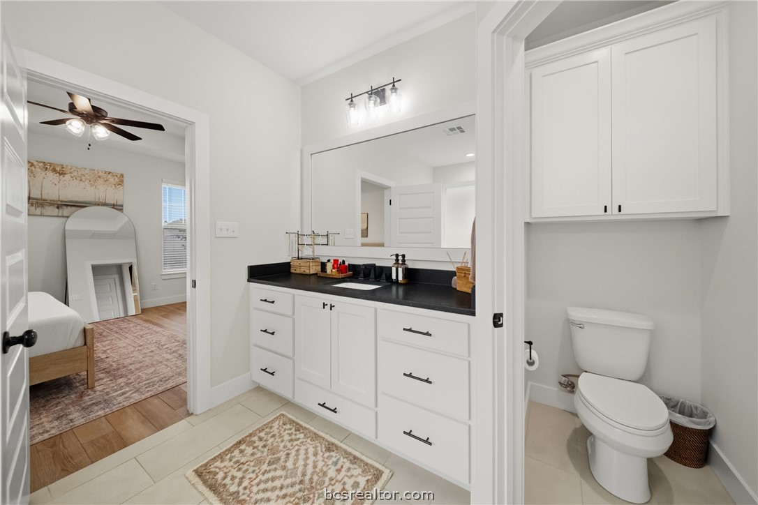 3520 Fairhope Way Bryan, TX 77808 - Photo 21 of 39 a bathroom with a toilet a sink and mirror