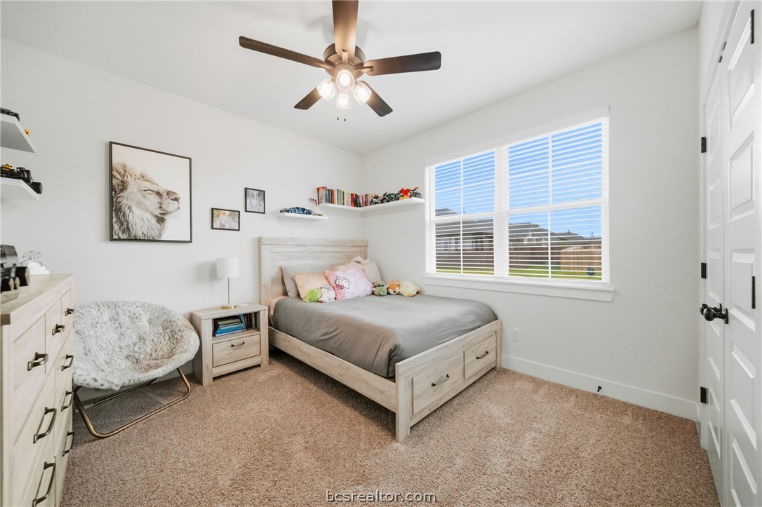 3520 Fairhope Way Bryan, TX 77808 - Photo 23 of 39 a bedroom with a bed and a window