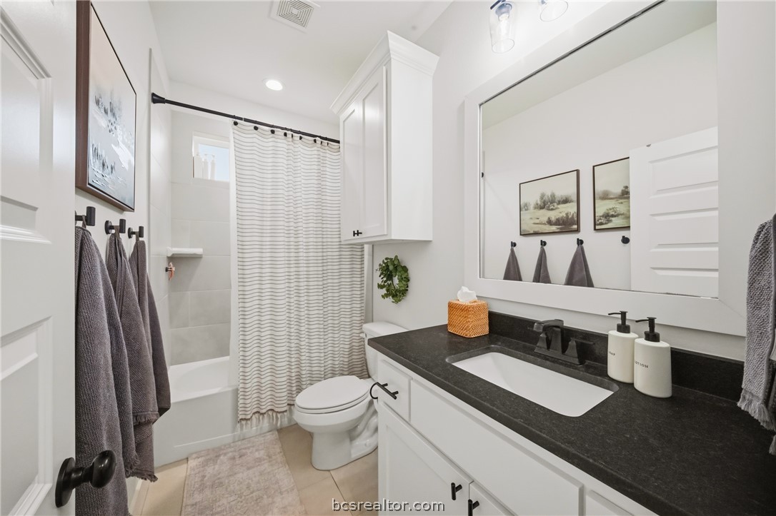 3520 Fairhope Way Bryan, TX 77808 - Photo 24 of 39 a bathroom with a sink a toilet and shower