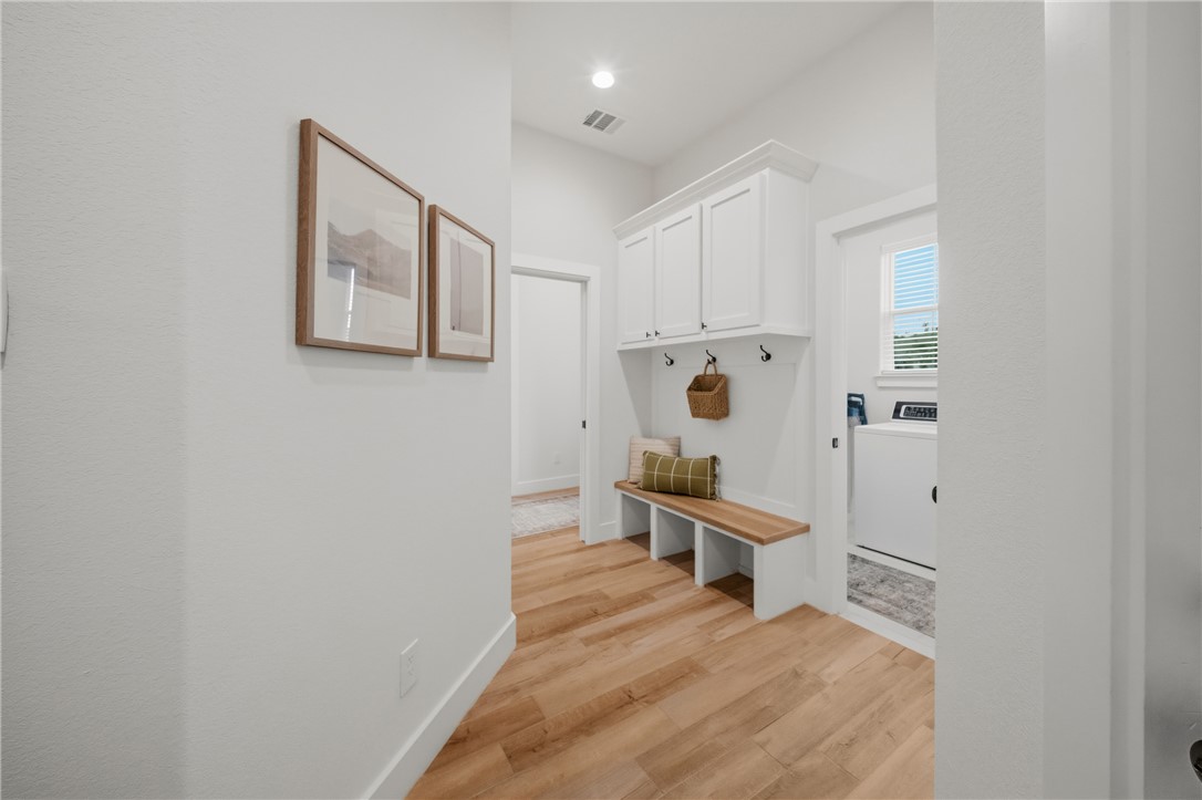 3520 Fairhope Way Bryan, TX 77808 - Photo 27 of 39 a room with a white wall and a chair