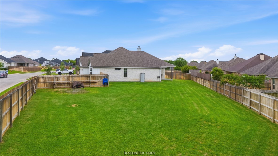 3520 Fairhope Way Bryan, TX 77808 - Photo 33 of 39 a view of an house with a big yard and potted plants