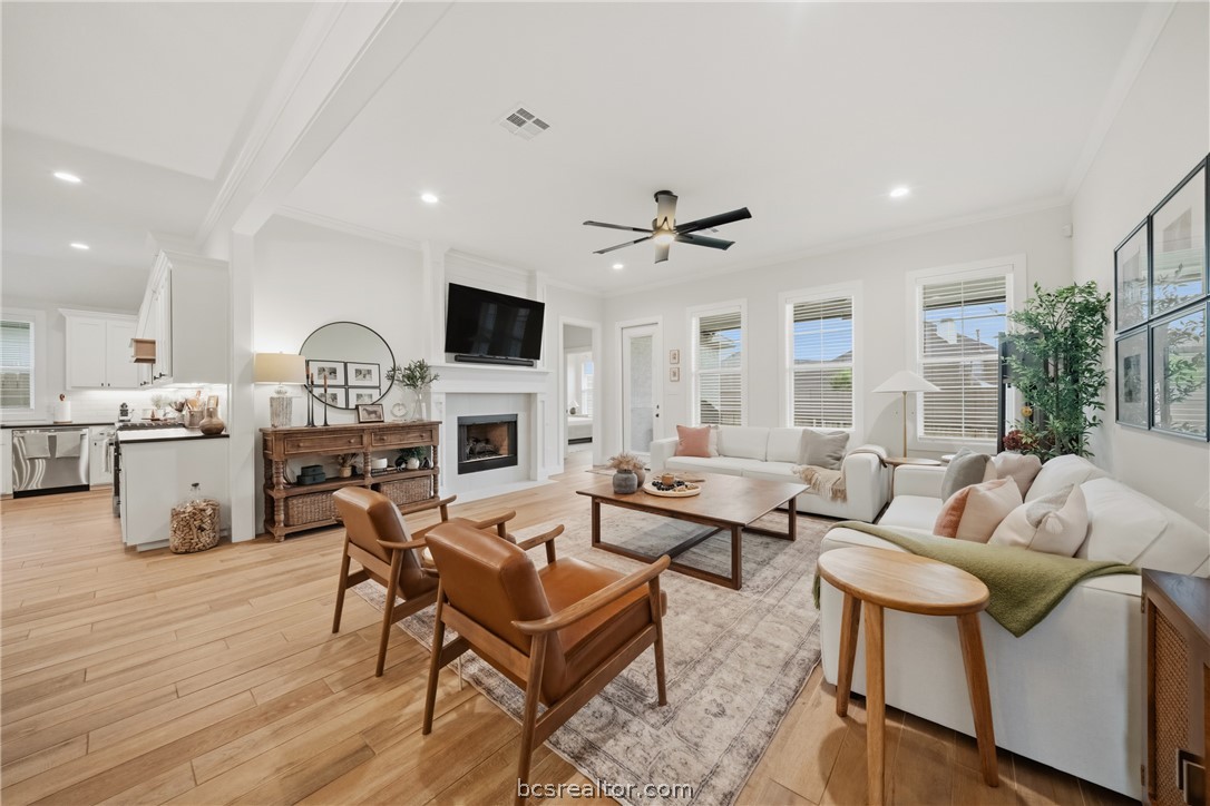 3520 Fairhope Way Bryan, TX 77808 - Photo 7 of 39 a living room with fireplace furniture and a wooden floor