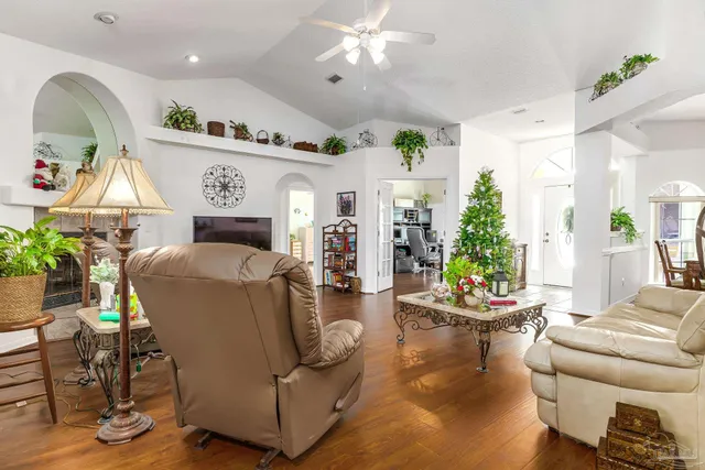 a view of a swimming pool with outdoor seating and a yard