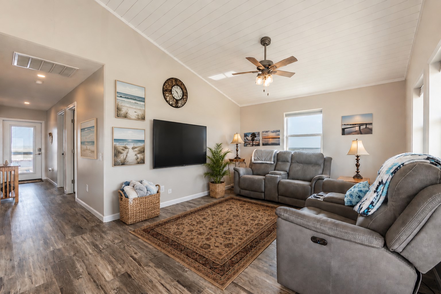 1453 County Road 230 Sargent, TX 77414 - Photo 9 of 38 This virtually staged living room offers a cozy and inviting space with elegant flooring, ample natural light, perfect for relaxation and entertainment.
