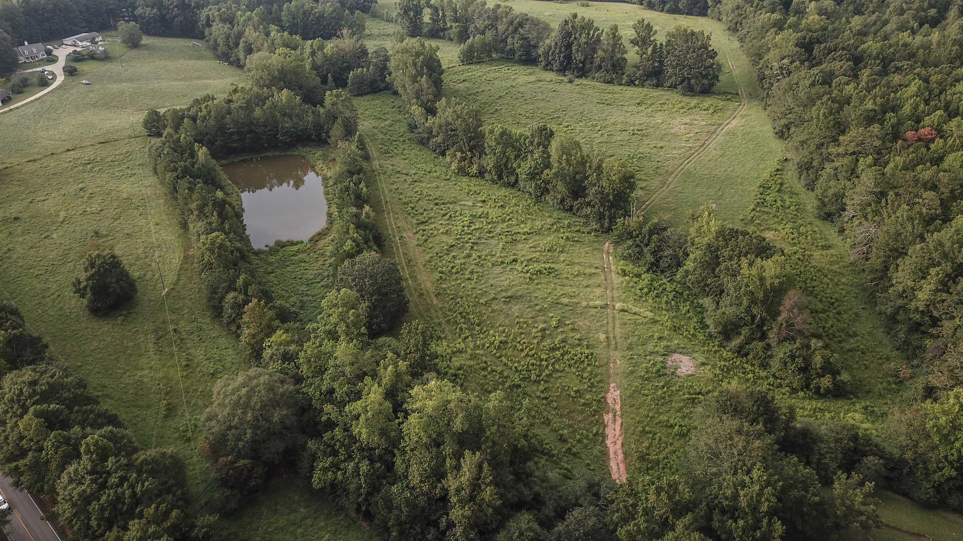 a aerial view of a house with a yard