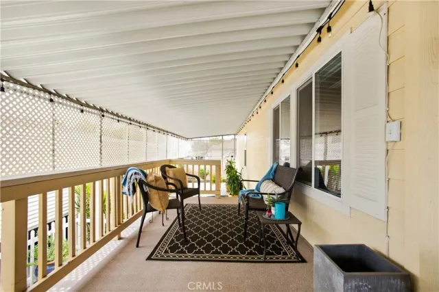 a view of a chairs and bench in balcony