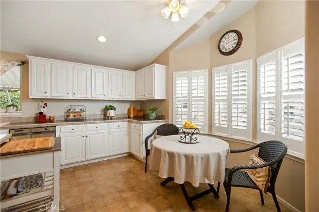 a kitchen with a dining table and chairs