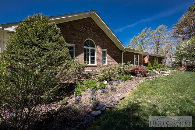 1762 Hidden Spring Road West Jefferson, NC 28694 - Photo 13 of 46 a front view of a house with a yard