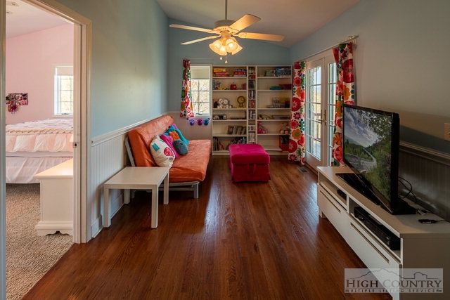 1762 Hidden Spring Road West Jefferson, NC 28694 - Photo 17 of 46 a living room with furniture a flat screen tv and a wooden floor