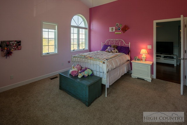 1762 Hidden Spring Road West Jefferson, NC 28694 - Photo 18 of 46 a bedroom with a bed and a window
