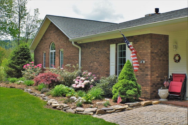 1762 Hidden Spring Road West Jefferson, NC 28694 - Photo 24 of 46 a front view of a house with a yard