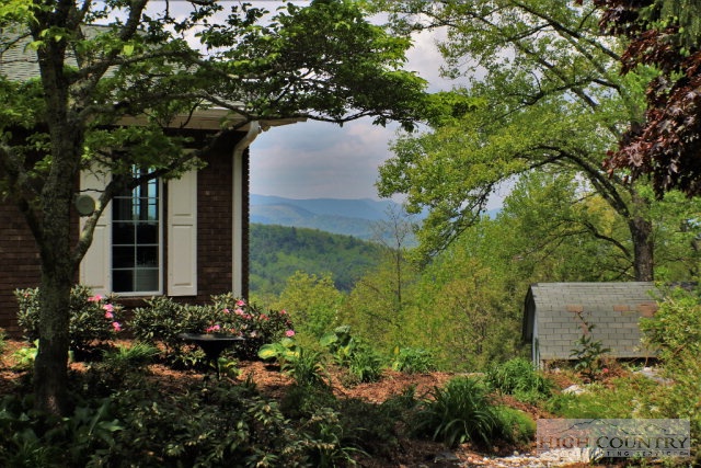 1762 Hidden Spring Road West Jefferson, NC 28694 - Photo 35 of 46 a house with a tree in the background