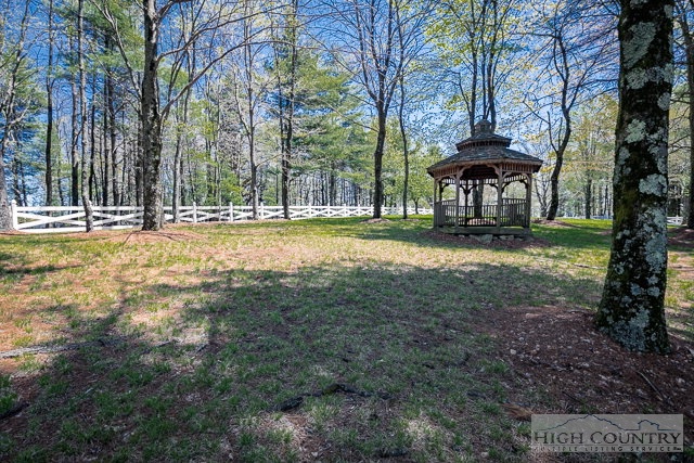 1762 Hidden Spring Road West Jefferson, NC 28694 - Photo 38 of 46 a view of a yard with a table and chair