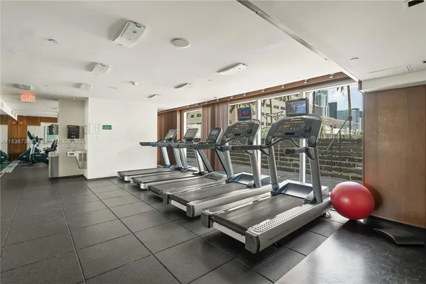 a living room with furniture a table and chairs