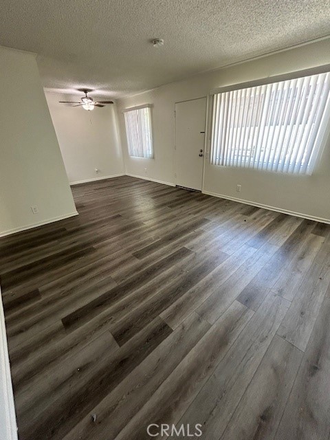 68460 Kings Road, Unit C Cathedral City, CA 92234 - Photo 10 of 18 an empty room with wooden floor and windows