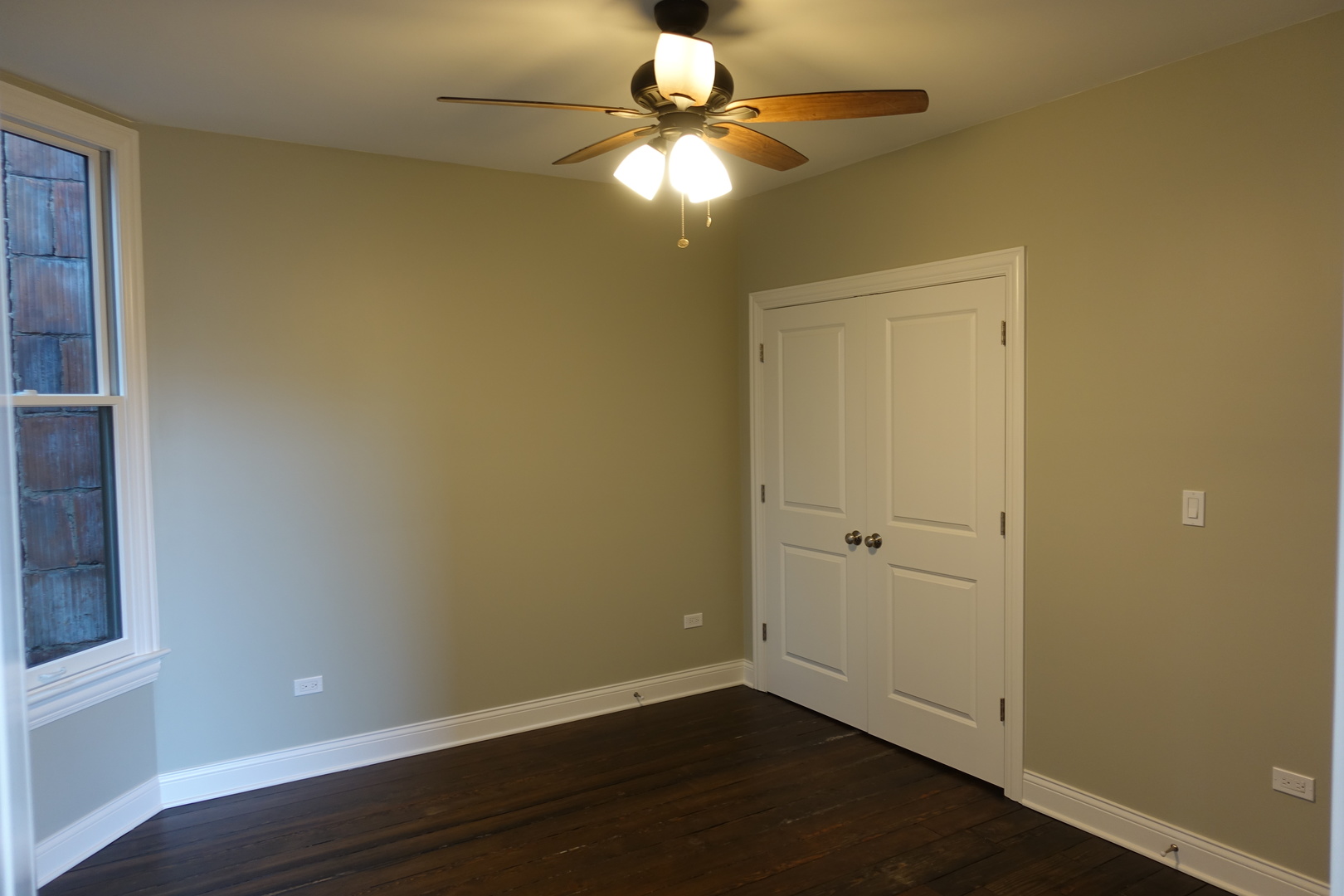 809 North Franklin Street, Unit 2F Chicago, IL 60610 - Photo 9 of 14 a view of a room with wooden floor and a window