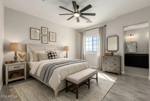 a bedroom with a bed and a dresser