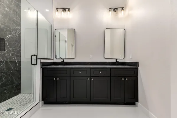 a bathroom with a sink and a mirror