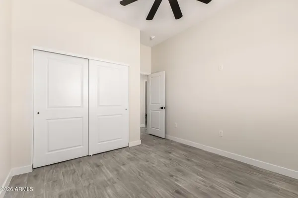 an empty room with ceiling fan