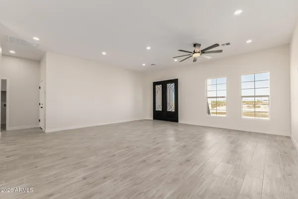 a view of an empty room with a window