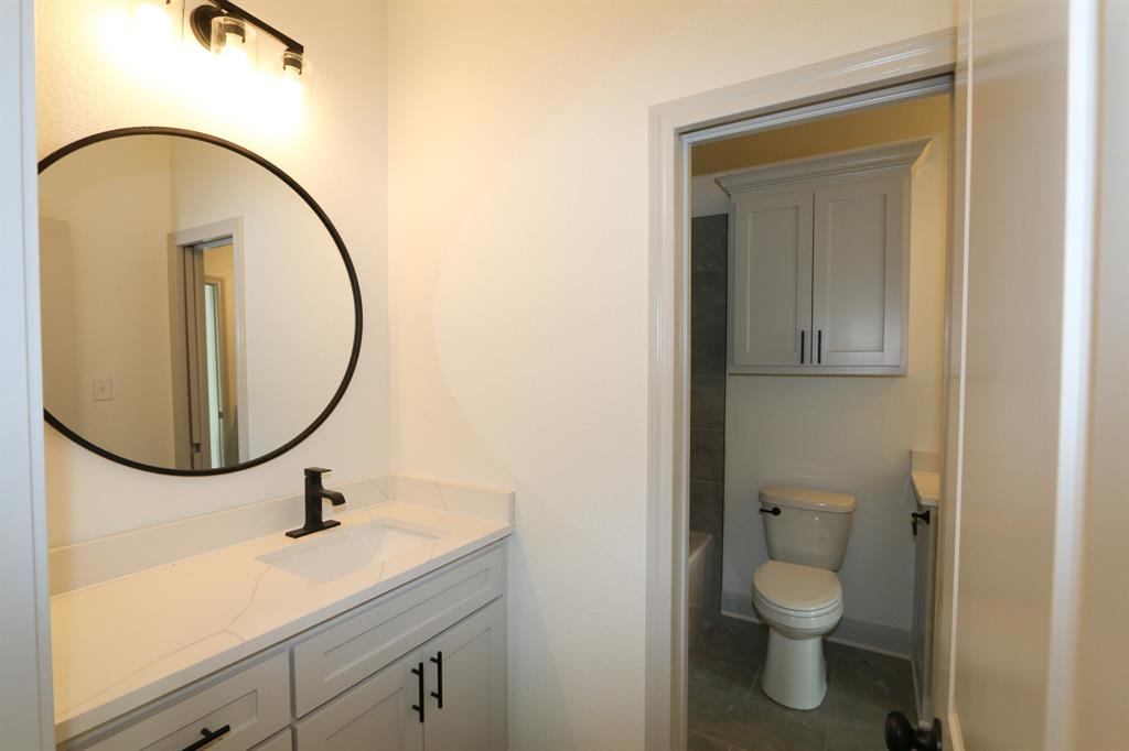 16527 Cooper Way Flint, TX 75762 - Photo 22 of 28 a bathroom with a sink and a mirror