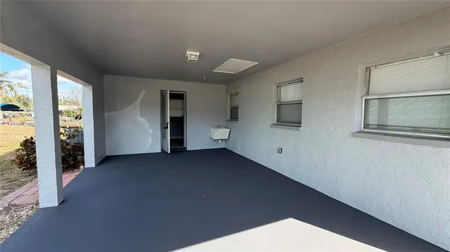 a view of empty room with windows