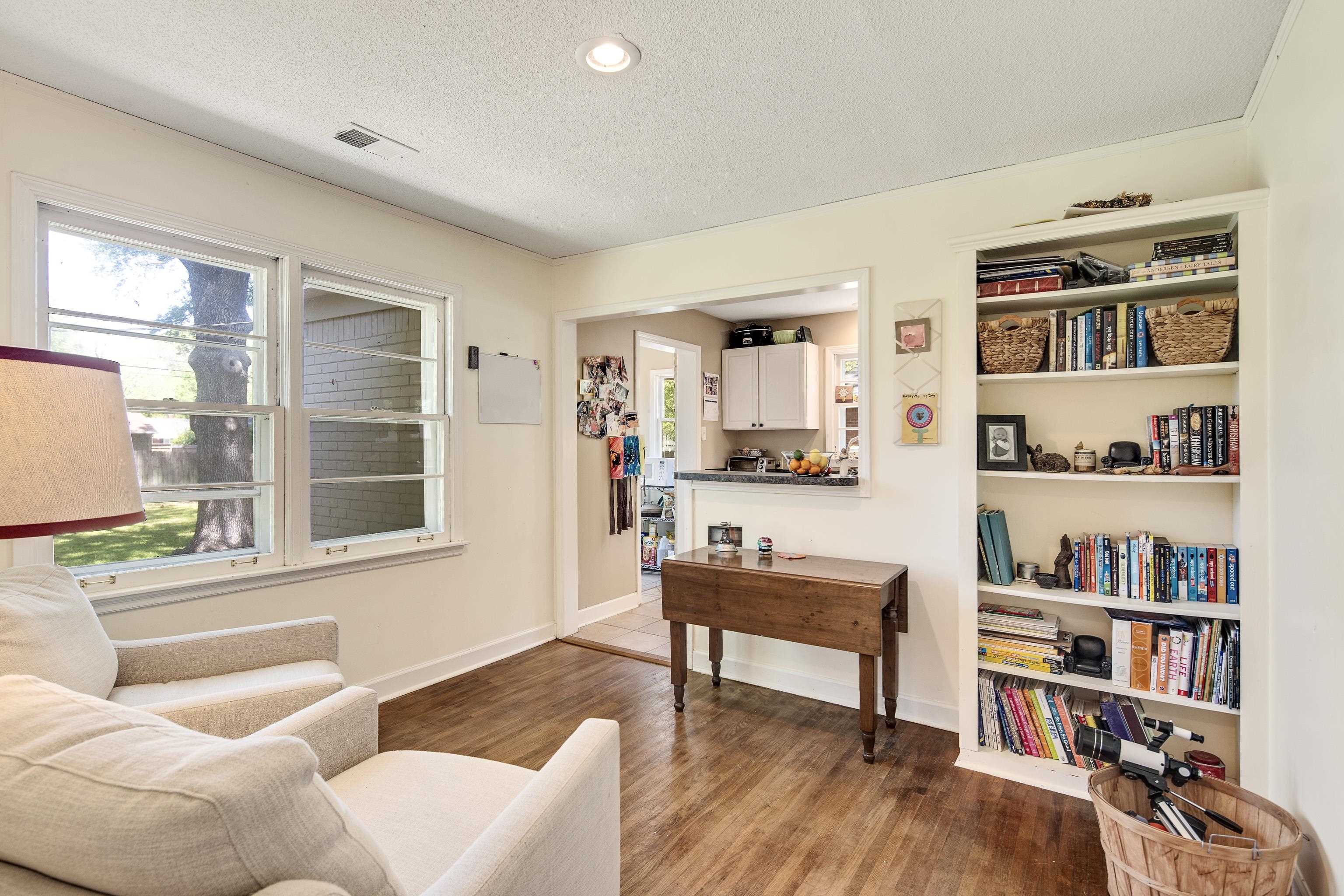 4566 Amboy Road Memphis, TN 38117 - Photo 12 of 29 a living room with furniture and a book shelf