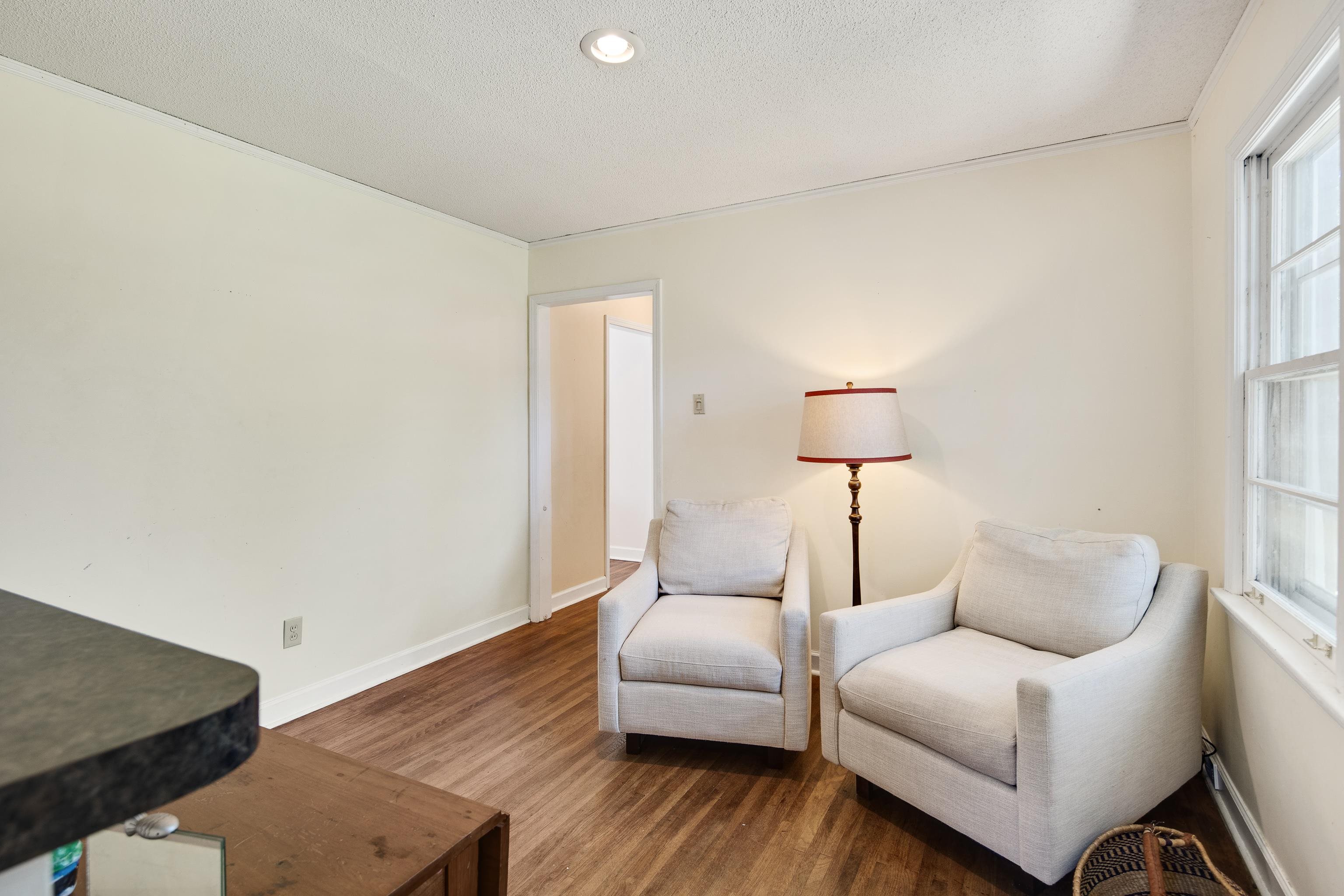 4566 Amboy Road Memphis, TN 38117 - Photo 14 of 29 a living room with furniture and a lamp