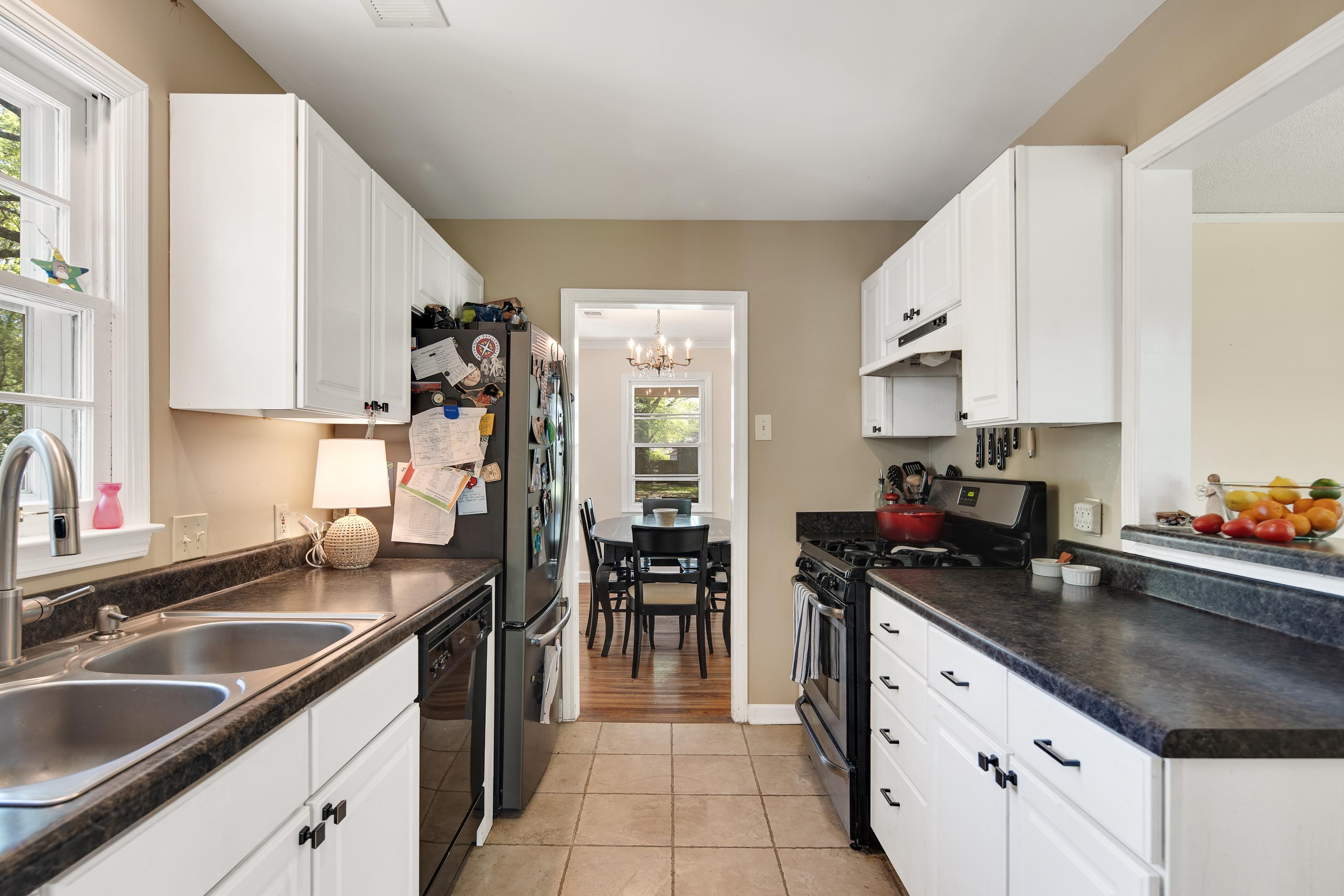 4566 Amboy Road Memphis, TN 38117 - Photo 16 of 29 a kitchen with a sink stove and cabinets
