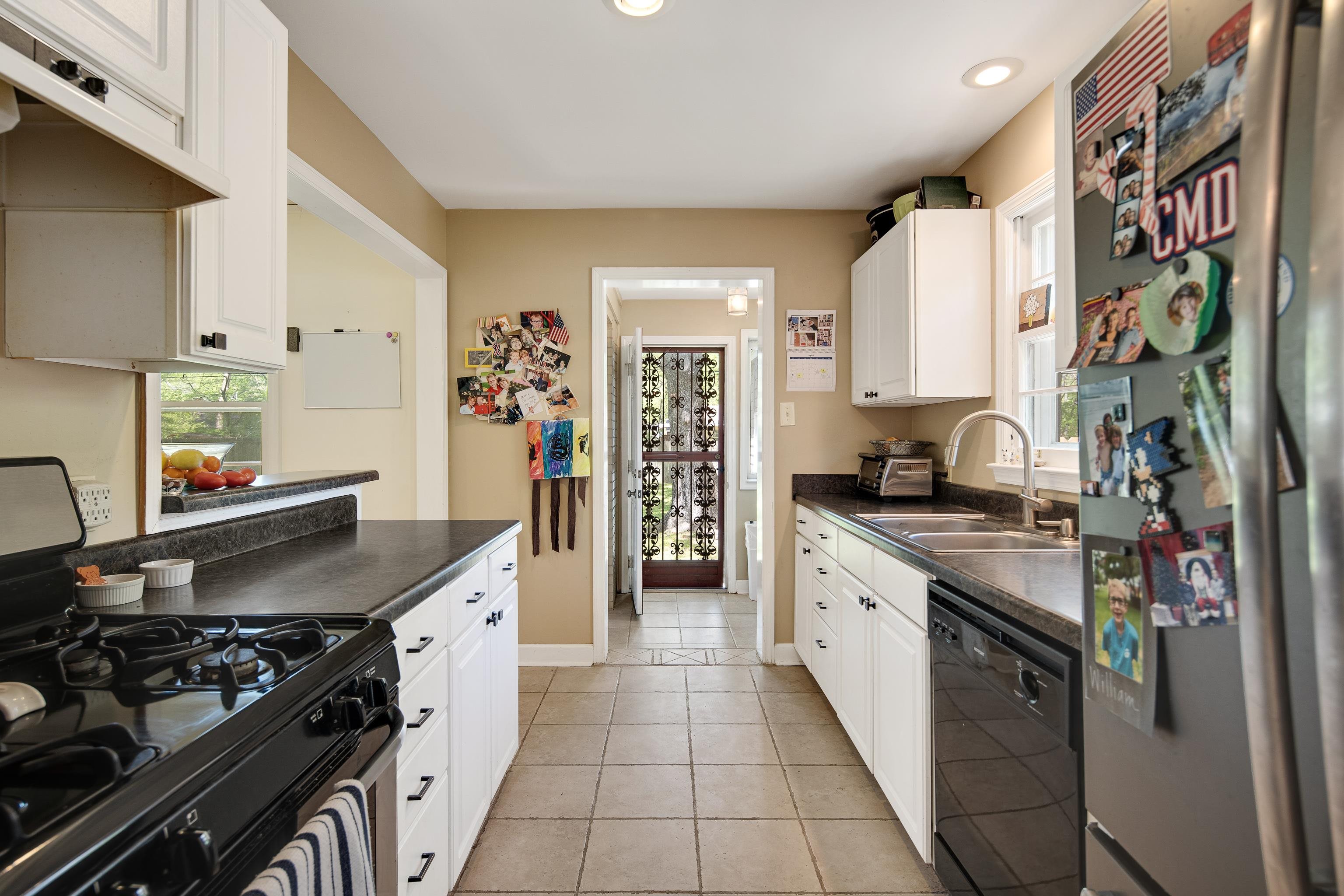 4566 Amboy Road Memphis, TN 38117 - Photo 17 of 29 a large kitchen with stainless steel appliances granite countertop a stove and a sink