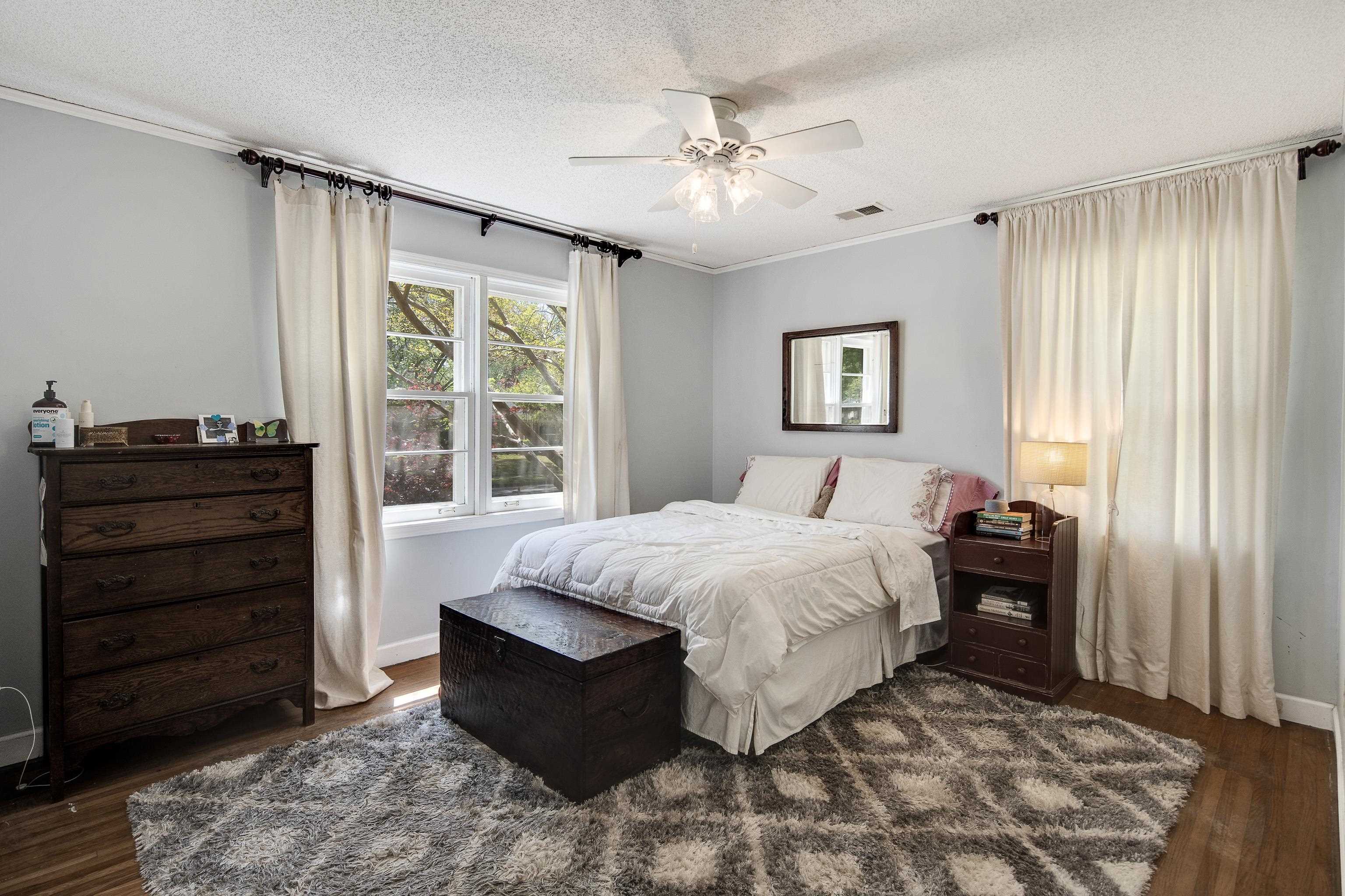4566 Amboy Road Memphis, TN 38117 - Photo 19 of 29 a bedroom with a bed and a dresser