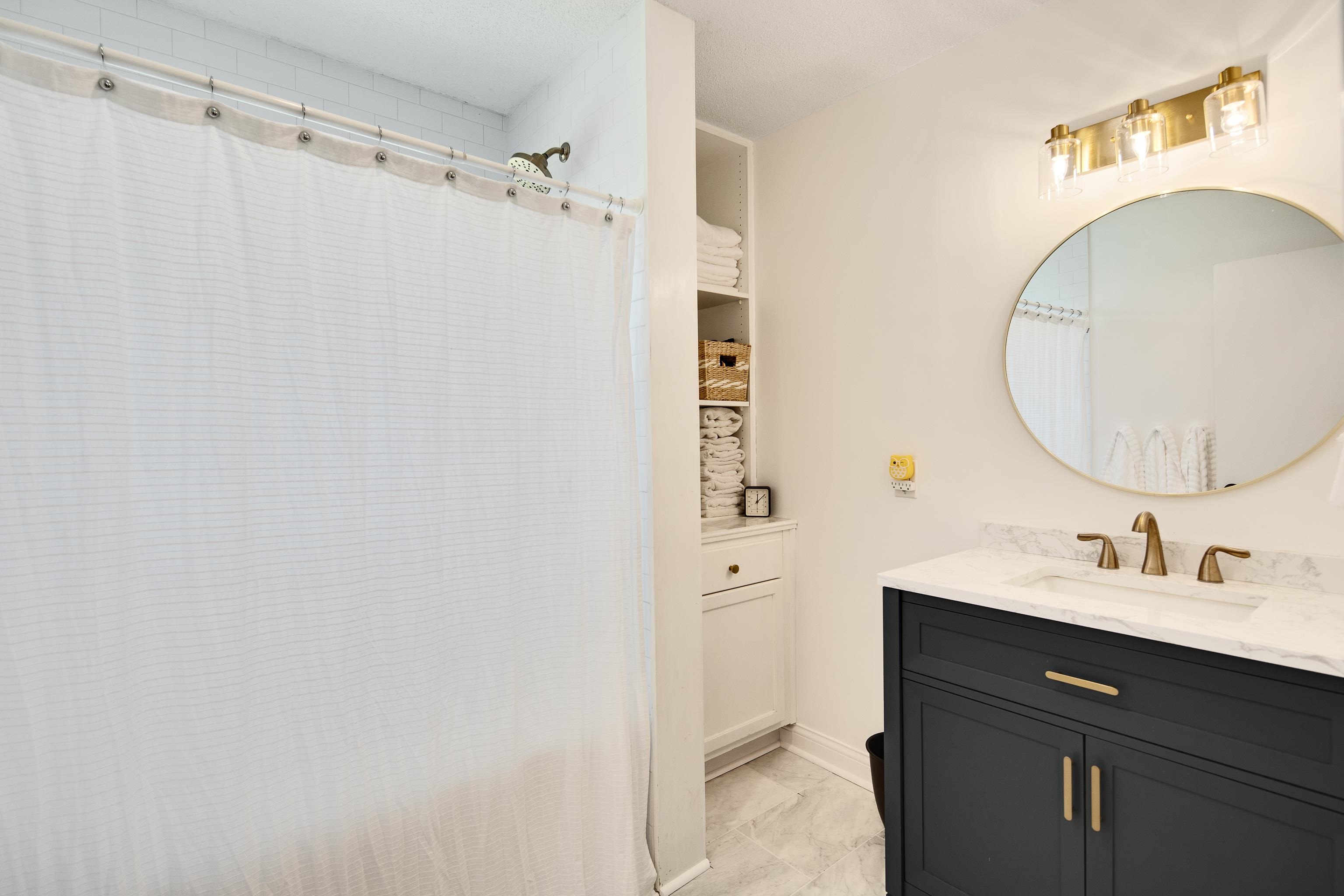 4566 Amboy Road Memphis, TN 38117 - Photo 21 of 29 a bathroom with a sink and a mirror