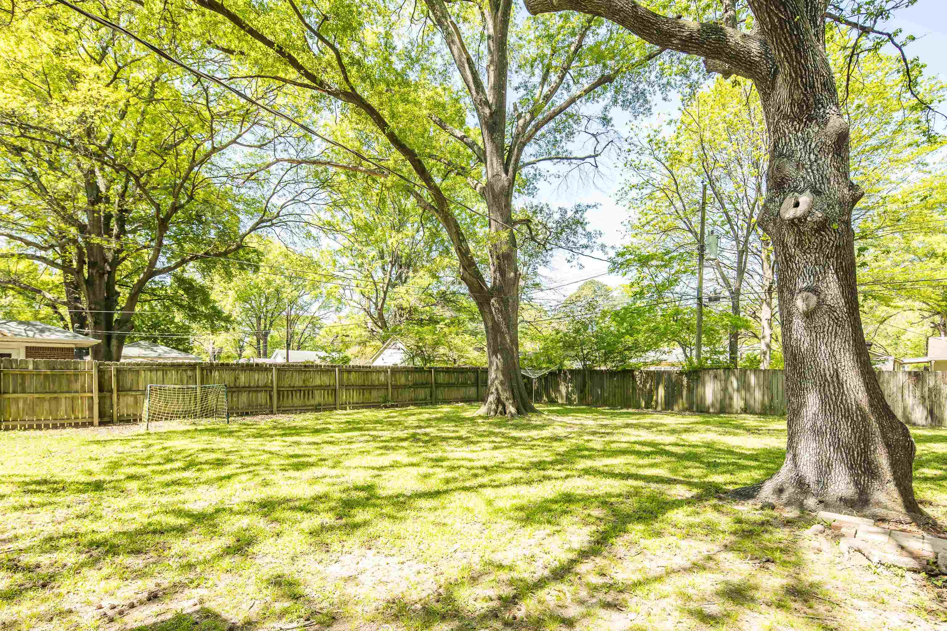 4566 Amboy Road Memphis, TN 38117 - Photo 25 of 29 a swimming pool with outdoor seating and yard
