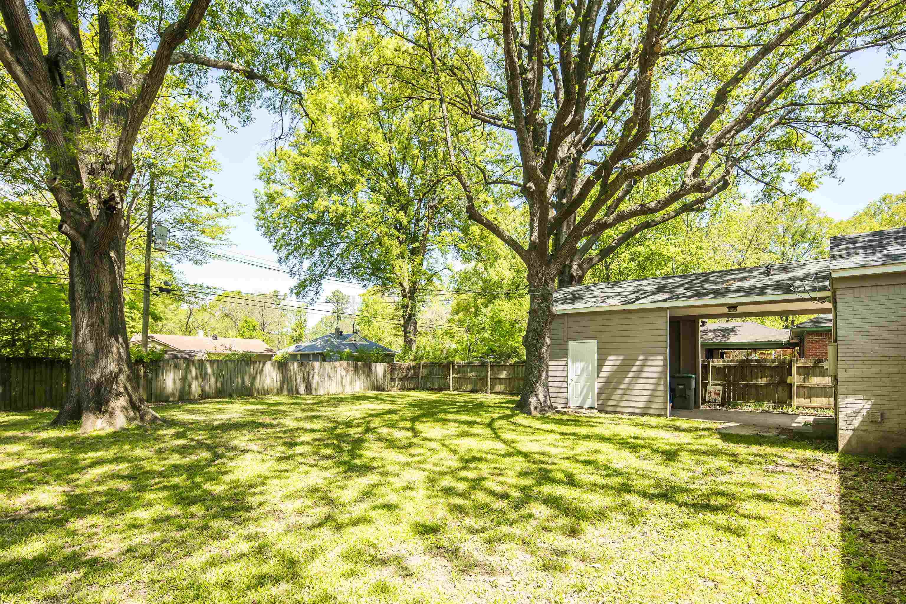 4566 Amboy Road Memphis, TN 38117 - Photo 26 of 29 a front view of a house with a garden