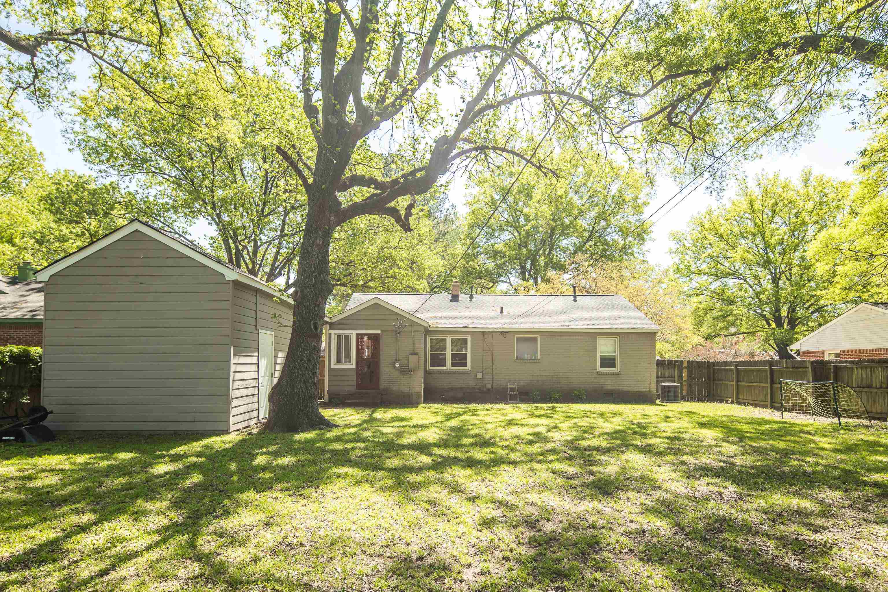 4566 Amboy Road Memphis, TN 38117 - Photo 29 of 29 a front view of a house with a garden